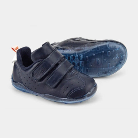 Navy blue children's shoes with velcro straps on a light gray background