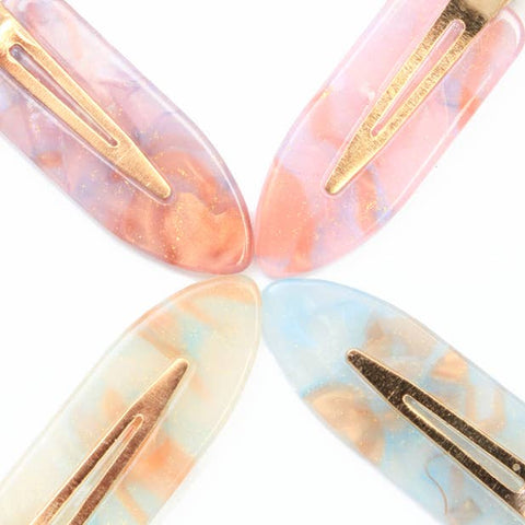 Creaseless setting clips in pastel shades